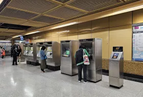 On the left single ticket machines, on the right Octopus Card top-up machines