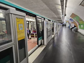 Metro station with barriers for new trains