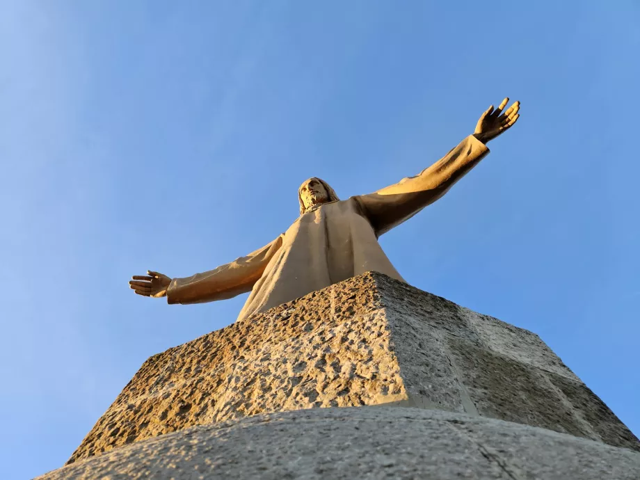 The statue of Christ at the top of the temple tower