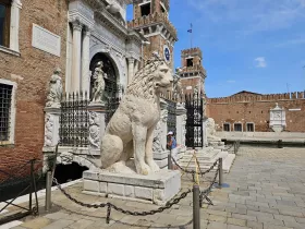 Statue of a lion in front of the Venetian shipyards