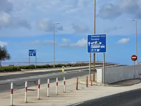 Traffic signs towards the ferry